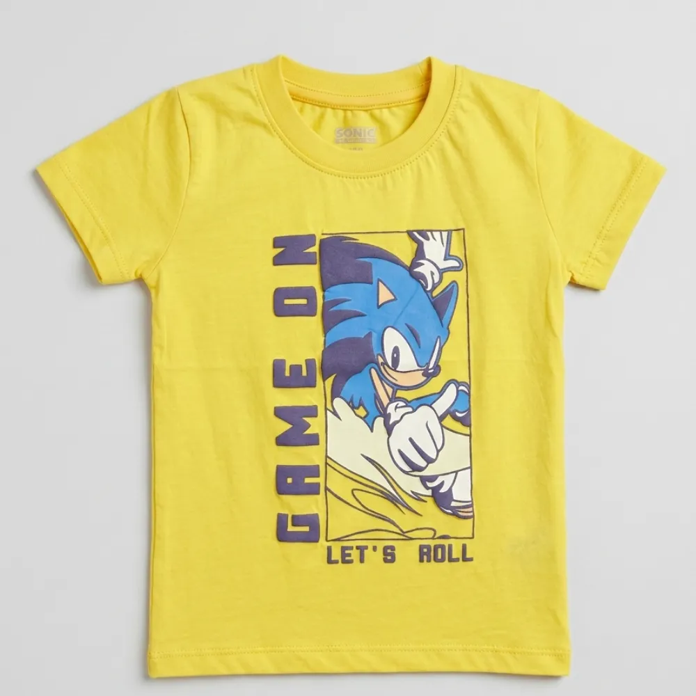 Yellow short-sleeved t-shirt with a graphic of Sonic the Hedgehog and the text 'GAME OVER LET'S ROLL' in purple.